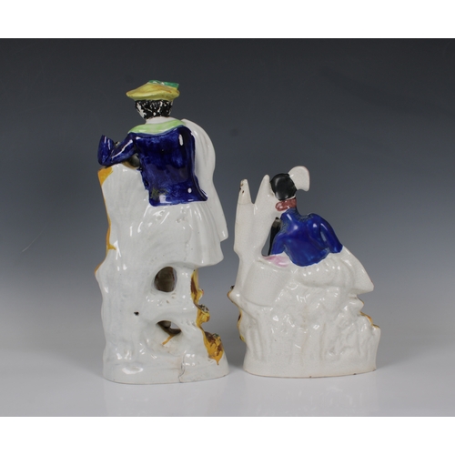 2062 - Two 19th century Staffordshire ceramic figures, of a young Scottish soldier leaning on a drum, a can... 