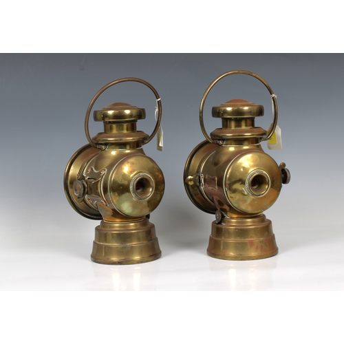 1082 - A pair of early 20th century Lucas brass oil automobile lightsclear glass to the front, red glass to... 