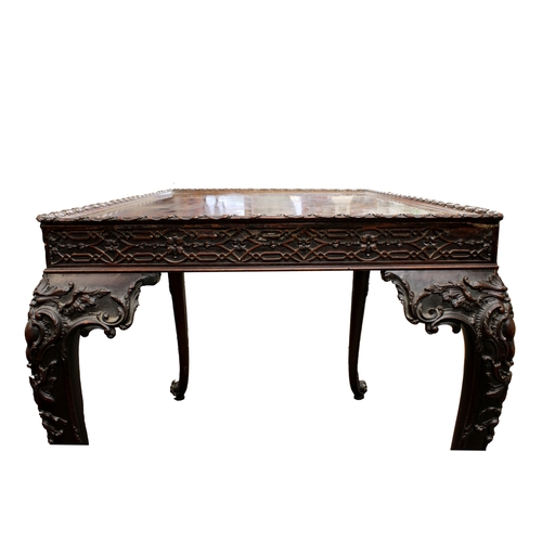 60 - A George III carved mahogany silver tablethe rectangular top with fretwork above a carved frieze on ... 