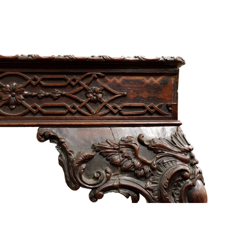 60 - A George III carved mahogany silver tablethe rectangular top with fretwork above a carved frieze on ... 