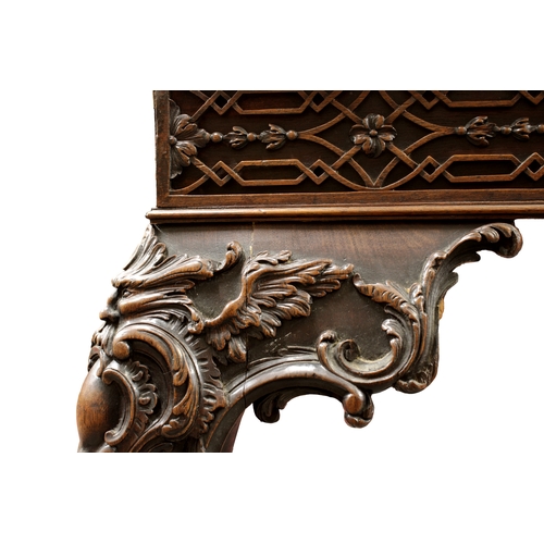 60 - A George III carved mahogany silver tablethe rectangular top with fretwork above a carved frieze on ... 