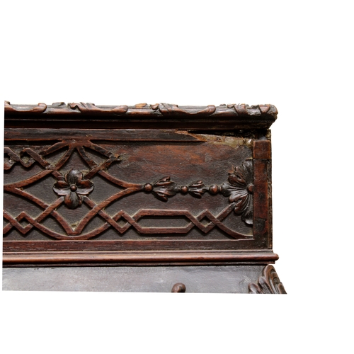 60 - A George III carved mahogany silver tablethe rectangular top with fretwork above a carved frieze on ... 