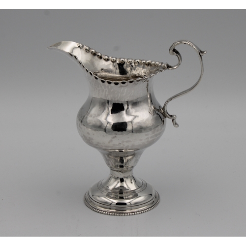 391A - A George III silver baluster cream jug