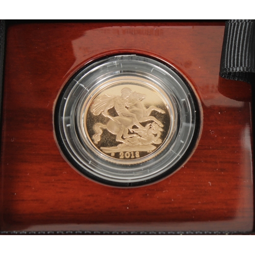 14 - An Elizabeth II Proof Sovereign, bust obverse, reverse George and the Dragon, dated 2018, in plastic... 