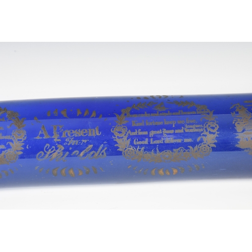 101 - An early 19th century unusually large 'Mariners' Bristol glass cobalt blue rolling pin gilt transfer... 