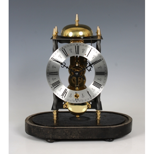 14 - A reproduction German made skeleton clock with dome overall height 35.6cm.