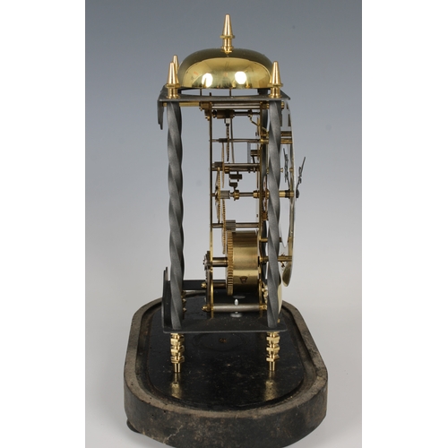 14 - A reproduction German made skeleton clock with dome overall height 35.6cm.