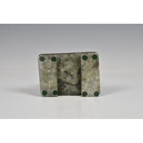 146 - An Oriental green hardstone figure of a deity / scholar sitting upon a raised platform, 7 3/8in. (18... 