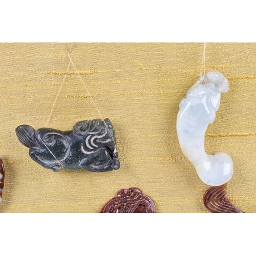 162 - A small collection of modern Chinese jade and stone carvings to include various fish in different fo... 