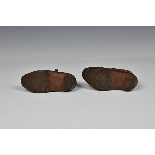 181 - A pair of antique brown leather child's clogs.