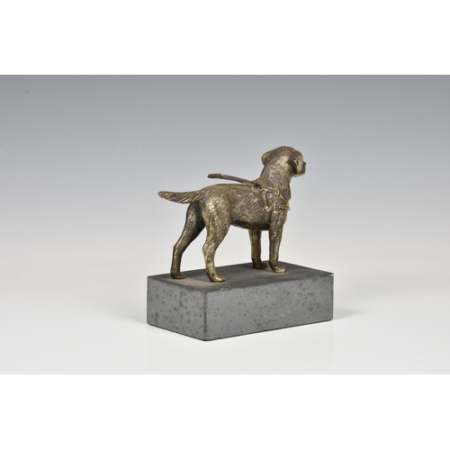 182 - A vintage Guide Dog paperweight / clip the gilt metal Guide Dog, standing upon a rectangular stone p... 