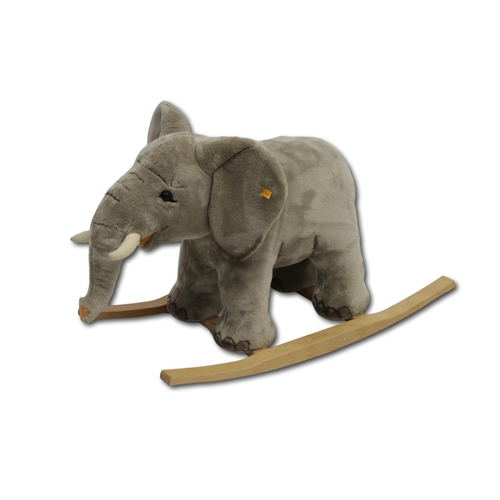 226 - A Steiff rocking Trampili elephant soft grey woven faux fur, solid beech rockers and stainless steel... 