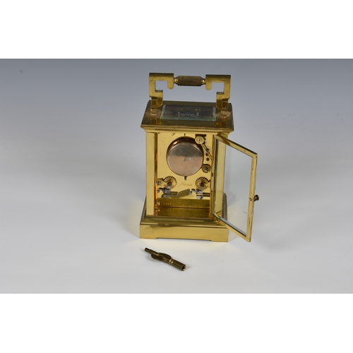 227 - A French gilt brass carriage clock early 20th century, signed to the white, Roman enamel dial by the... 