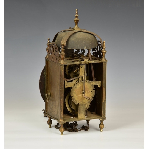 23 - A late 19th century lantern clock in the 17th century style, the four pillar, weight driven movement... 