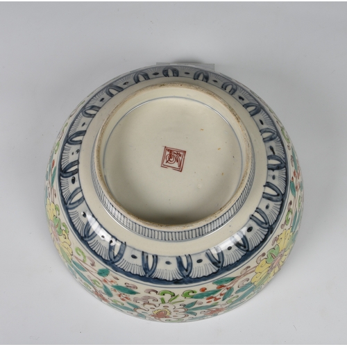 236 - A Japanese porcelain punch bowl 19th century, probably for the Chinese market, painted in polychrome... 