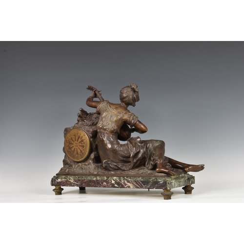 247 - A French bronzed spelter and marble mantel clock late 19th century, the figure of a seated female mu... 