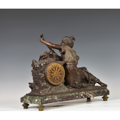 247 - A French bronzed spelter and marble mantel clock late 19th century, the figure of a seated female mu... 