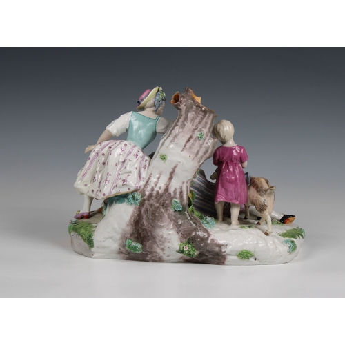 281 - A Continental late 19th century ceramic figure group wearing fashionable dress, incorporating a spil... 