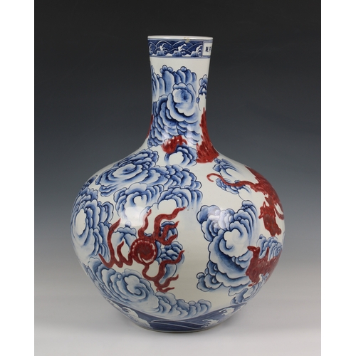 314 - A large Chinese porcelain bottle vase 19th / 20th century, ovoid body rising from recessed unglazed ... 