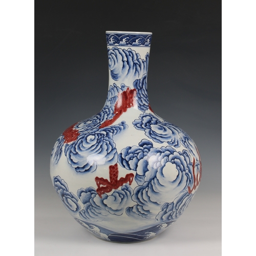 314 - A large Chinese porcelain bottle vase 19th / 20th century, ovoid body rising from recessed unglazed ... 