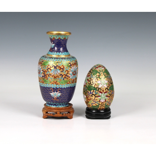 388 - A 20th Century Chinese cloisonné and champlevé enamel vase decorated with lotus flowers and scrollin... 