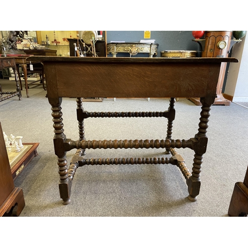 464 - An English 17th century oak side table with two short drawers above four bobbin turned legs and stre... 