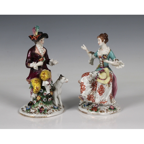 469 - A pair of German porcelain figures of an elegantly dressed couple the man with a hound and the woman... 