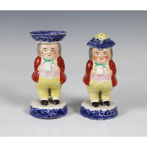 470 - A pair of Victorian Staffordshire salt and pepper condiments modelled as toby's, their hats and circ... 