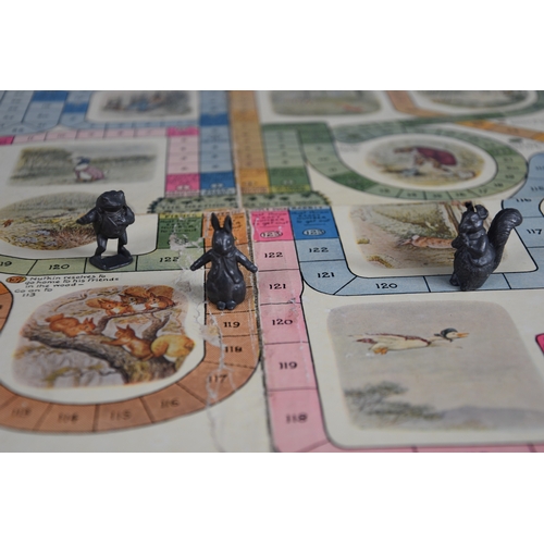 5 - Peter Rabbits Race Game, circa 1921 comprising a playing board with four original lead playing piec... 