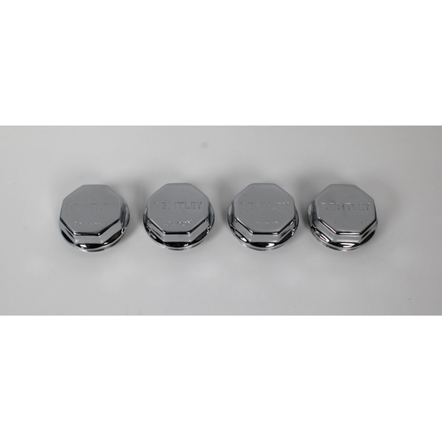 535 - Four chrome plated Bentley hub dust caps each inscribed "Bentley London", 7cm. diameter.