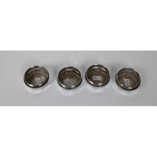 535 - Four chrome plated Bentley hub dust caps each inscribed "Bentley London", 7cm. diameter.