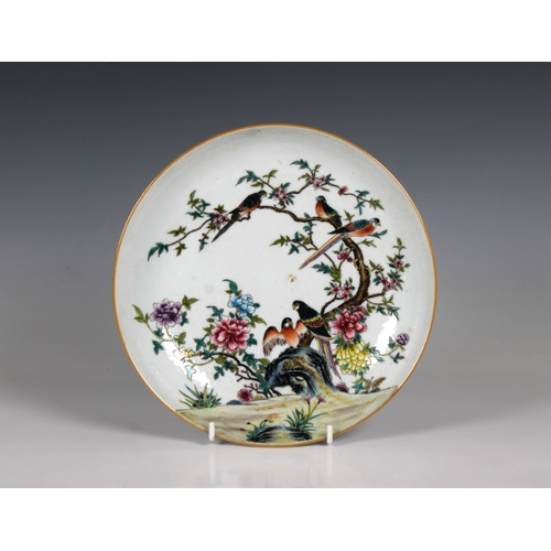 539 - A Chinese famille rose enamelled dish the interior of the shallow bowl painted with exotic birds at ... 