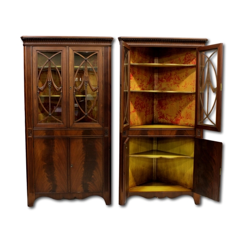 566 - A pair of Mahogany corner cabinets by Century Furniture Co.