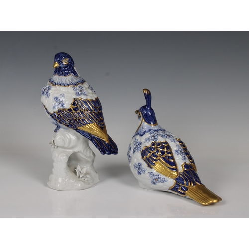 581 - A pair of Capodimonte bird figurines in blue & white with gilt highlights, the largest 21cm. high. (... 