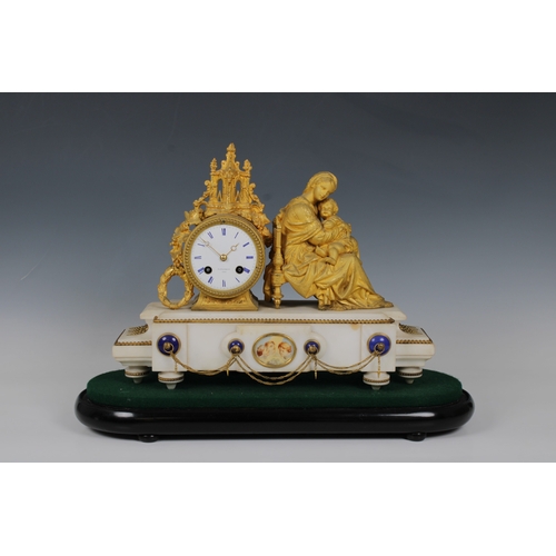 595 - An onyx and ormolu figural mantel clock by Platnauer Freres, Paris modelled as a recumbent mother an... 