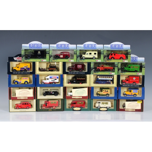 615 - A collection of twenty four Lledo 'Days Gone' and other die-cast vehicles of varying series and type... 