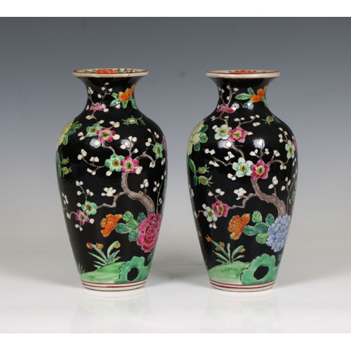 631 - A pair of 20th century Chinese famille noir style vases decorated with pheasants amongst flowering t... 