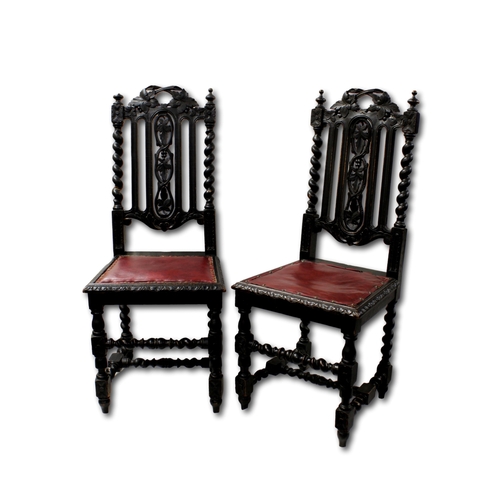 638 - A set of seven Victorian carved ebonised Carolean style chairs with foliate and barley twist carved ... 