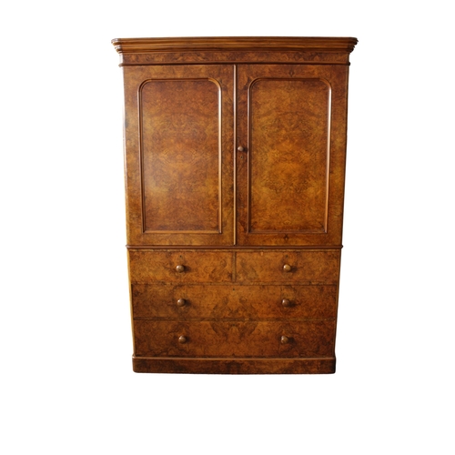 92 - A fine Victorian burr walnut linen press the two panelled doors with mirrored interior opening to fo... 