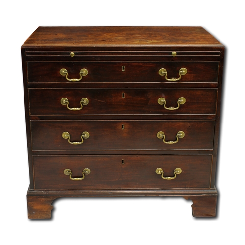 649 - A Georgian mahogany bachelors chest of drawers The rectangular top above a brush slide and four long... 