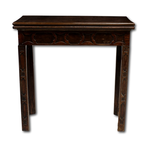 657 - An Eighteenth Century mahogany fold over card table With extensive blind feet carving and green baiz... 