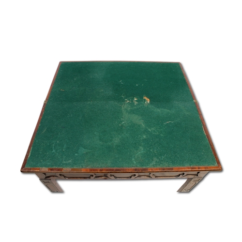 657 - An Eighteenth Century mahogany fold over card table With extensive blind feet carving and green baiz... 