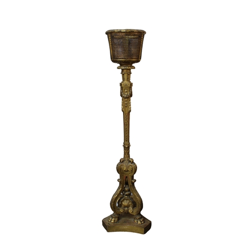 668 - A giltwood jardinière stand in the Louis XVI style, 19th century, the pail form top with cane sides ... 