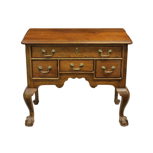 670 - A walnut Lowboy by Century Furniture, in the George I style, the rectangular top above one long and ... 