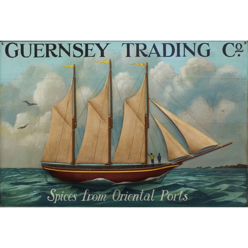 19 - A rare 'GUERNSEY TRADING Co' painted wooden advertising sign, with applied wooden ship in relief to ... 