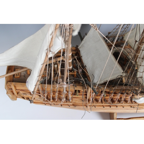 27 - A detailed wooden model of , HMS Bounty 1787, , made by Pirate & Co. Ltd Mauritius circa 2000, with ... 