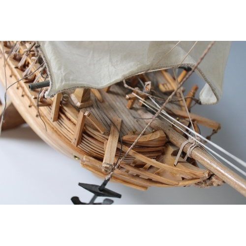 27 - A detailed wooden model of , HMS Bounty 1787, , made by Pirate & Co. Ltd Mauritius circa 2000, with ... 