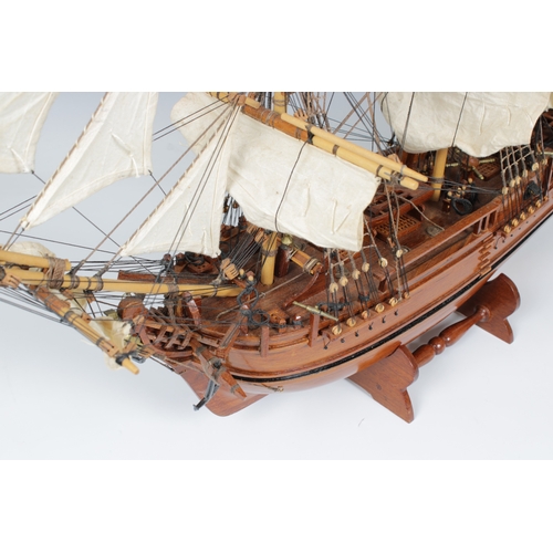 28 - A wooden H.M.S Bounty -1787- model, having wooden decks and detailed fixtures and fittings, linen sa... 