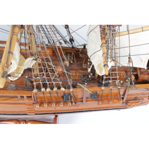 28 - A wooden H.M.S Bounty -1787- model, having wooden decks and detailed fixtures and fittings, linen sa... 