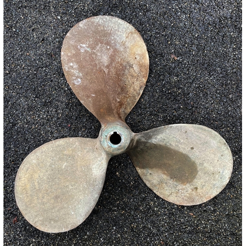 49 - A salvaged bronze three blade boat propeller.,